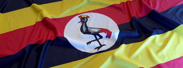 Flag of Uganda made of fabric. 