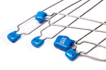 Electronic components: Group of low voltage ceramic capacitors on white background