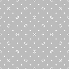Seamless dot pattern of small white flowers on a gray background.