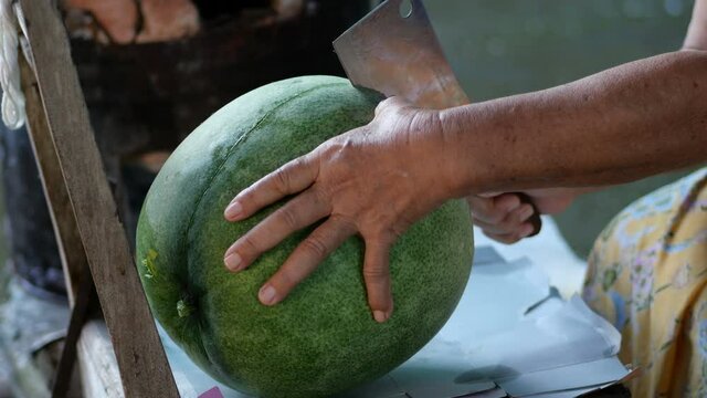 Closeup dissecting benincasa hispida for cooking