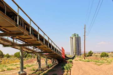 Long Abandoned Conveyor Belt With Walkway Coming From Storage Silos