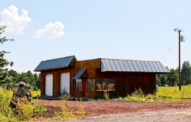 Deserted Wooden Building With Two Roll Up Doors