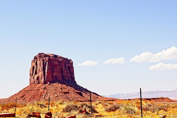 Lone Butte Jutting Above Monument Valley Desert Floor
