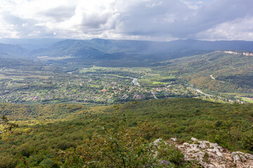 Naklejka premium Travel along the mountain range and plateau in a picturesque area, on a summer day, communication with nature, a tourist quest.