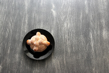 Delicious, fresh, sugary and freshly made Mexican dead bread that is made for the Day of the Faithful Dead and All Saints that is celebrated in November in Mexico
