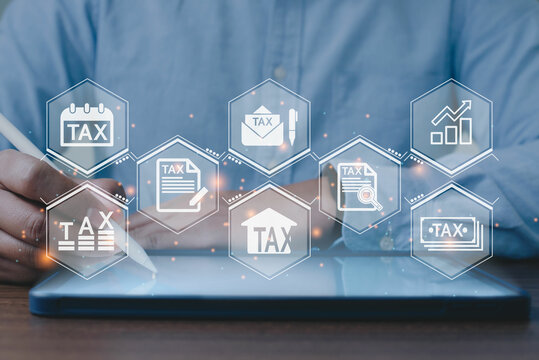 Businessman using a taplet to complete Individual income tax return form online for tax payment. tax, accounting, statistics and analytic research concept