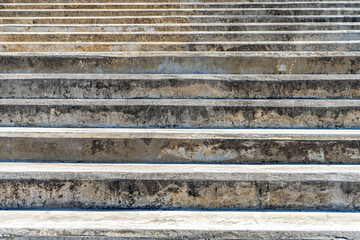Steps of an old concrete staircase on a public walkway.