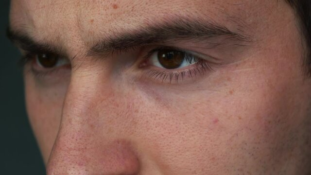 close-up look of a man with brown eyes. 4k footage