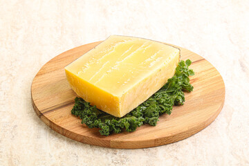 Parmesan cheese piece over board
