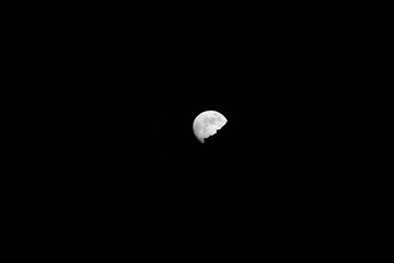 Dark contrast view of the moon at night. Dark contrast moon shot at night.