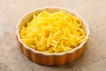 Shredded yellow cheese in the bowl