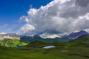 gorgeous nature landscape with mountains and little blue mountain lake panorama