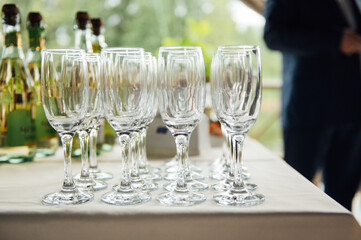 Glasses of champagne at the Banquet, white sparkling wine in wine glasses, festive mood