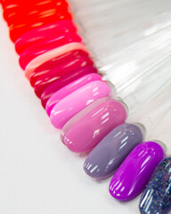 Multicolor different palette gel varnishes examples for manicure on the white background