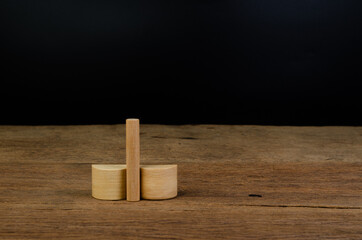 smaller penis than bigger penis sign from wooden cube block concept