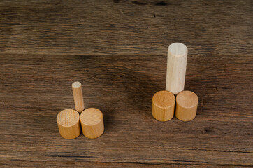smaller penis than bigger penis sign from wooden cube block concept