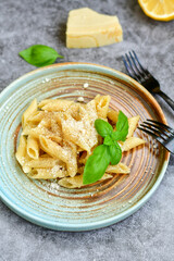 Home made fresh  italian  penne pasta    cacio e pepe. Pasta with Parmesan cheese and black peper