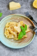 Home made fresh  italian  penne pasta    cacio e pepe. Pasta with Parmesan cheese and black peper