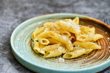 Home made fresh  italian  penne pasta    cacio e pepe. Pasta with Parmesan cheese and black peper