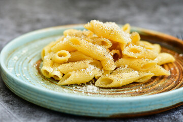 Home made fresh  italian  penne pasta    cacio e pepe. Pasta with Parmesan cheese and black peper