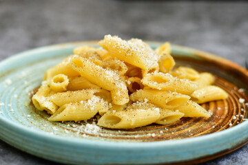 Home made fresh  italian  penne pasta    cacio e pepe. Pasta with Parmesan cheese and black peper