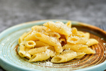 Home made fresh  italian  penne pasta    cacio e pepe. Pasta with Parmesan cheese and black peper