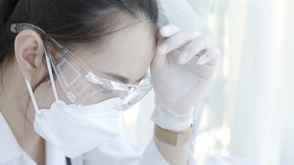 Female doctor,Stress and strain on doctors and nurses in clinic due to coronavirus pandemic