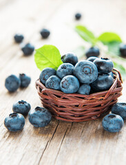 Blueberries on old wooden background