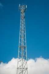 Telecommunication tower tower blue sky background.