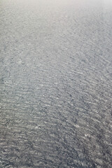 Valletta Malta March 18, 2018 Textured image of the Mediterranean sea water, light storm waves. Background picture.