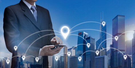 Business man hold smart Phone find location in city by GPS Navigator Map. Businessman in town use...