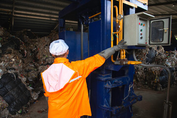 The waste disposal plant compresses the waste to be transported for recycling. - obrazy, fototapety, plakaty