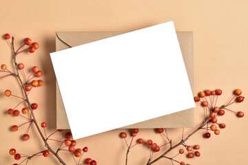 Postcard template on a beige background with an autumn branch of an apple tree.