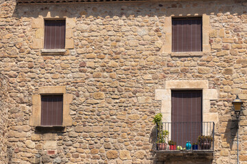 old stone facade in pals, on the costa brava