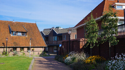 Morning walk in the beautiful city of Oldenzaal with a lovely garden on the sidewalk