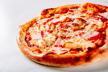 fast food. Hawaiian pizza with pineapple, ham, chicken, cheese, and vegetables