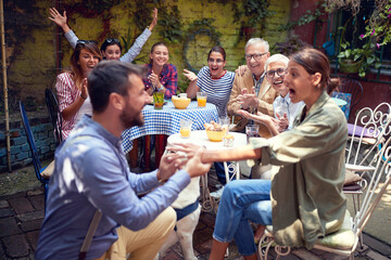 big surprise for young adult beautiful female as well as for people around by the beardy guy who just propose her to marry him