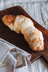 Artisan sourdough bread on wooden cutting board. Selective focus