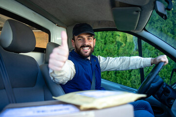 Fast delivery service and professional deliveryman in his van holding thumbs up.
