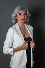 Adult woman with white hair smiling