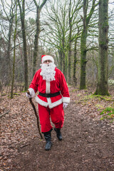 Santa Claus walks in the forest, he goes to the people for the Christmas holiday.