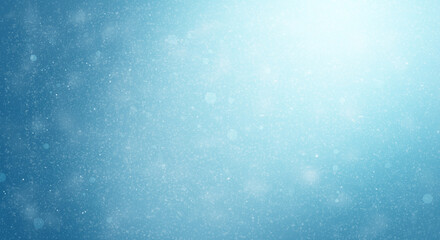Beautiful winter background. Light snow on a gentle blue background. Christmas concept.