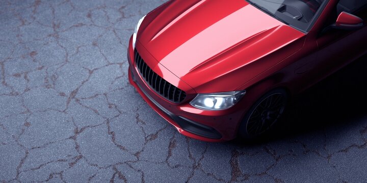 Unmarked metallic red sports car parked inside. Studio shot. 