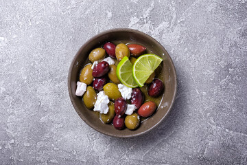 Bowl of delicious olives with Feta cheese in oil