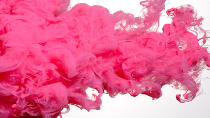 Pink cloud of ink on a white background. Awesome abstract background. Drops of pink ink in water....