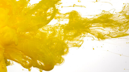 Colored acrylic paints in water. Yellow cloud of ink on a white background. Awesome abstract...