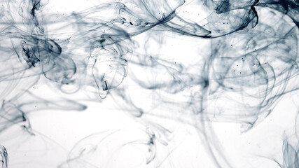 Colored acrylic paints in water. Black watercolor ink in water on a white background. Black cloud...