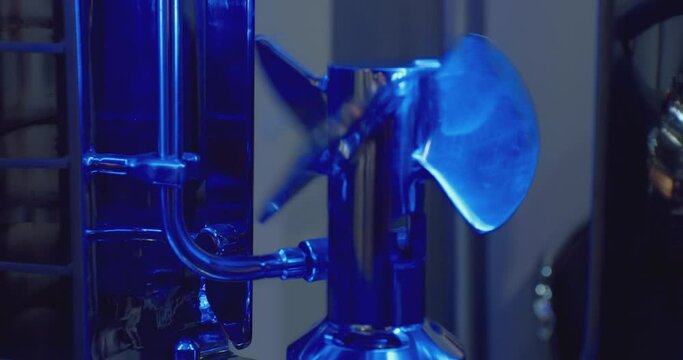 technological background.part of modern industrial equipment.the metal screw rotates slowly.close-up.