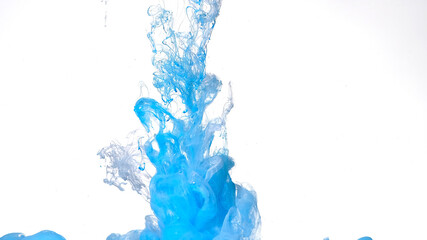 Blue and white watercolor ink in water on a white background. Beautiful abstract background. Blue...