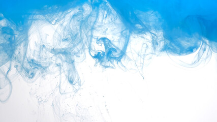 Fototapeta premium Blue watercolor ink in water on a white background. Beautiful abstract background. Blue paints are mixed in water.